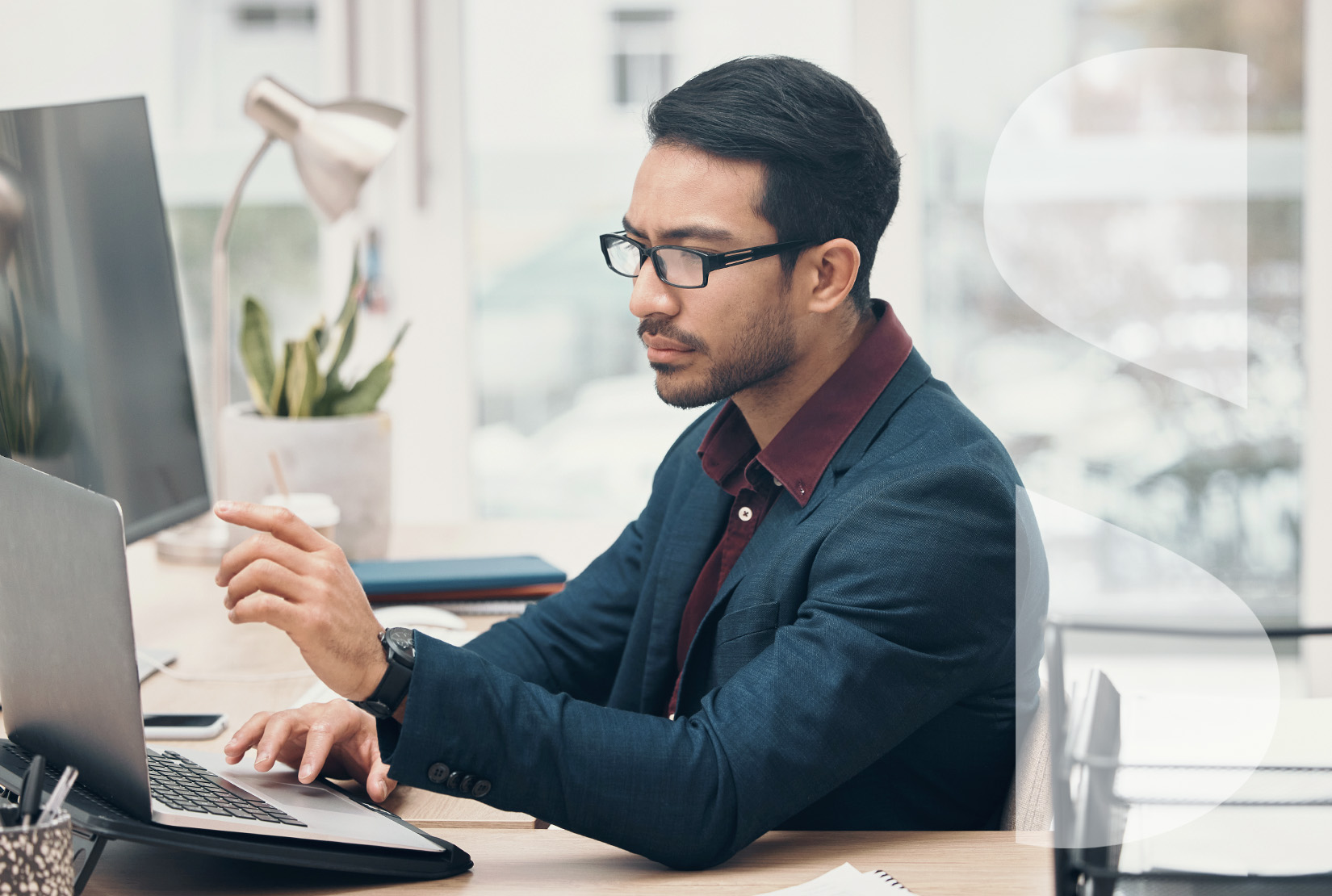 a professional adult man using a computer